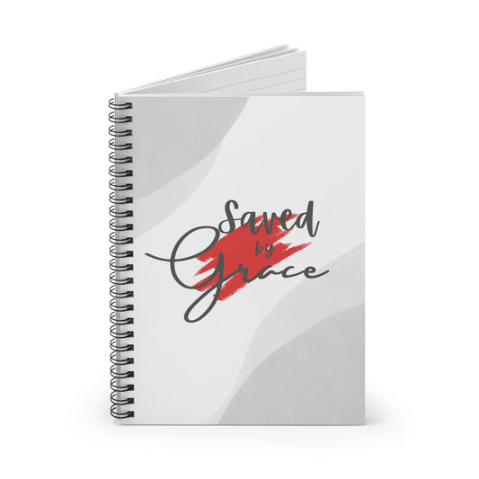 Notebook with 'Saved by Grace' design on a white background