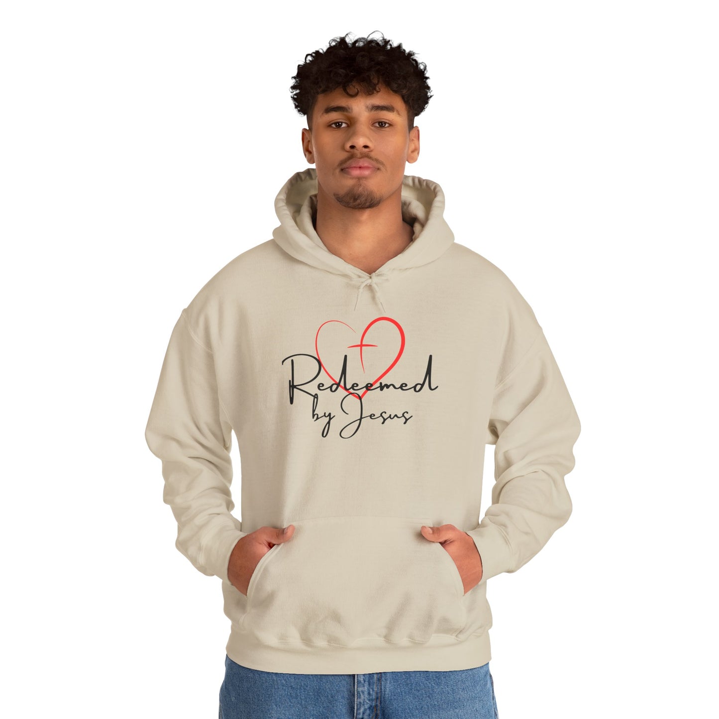 Person wearing a beige hoodie with 'Redeemed by Jesus' design on a white background