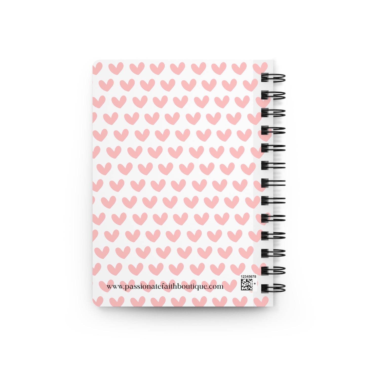 Back side of notebook with pink heart pattern on a white background