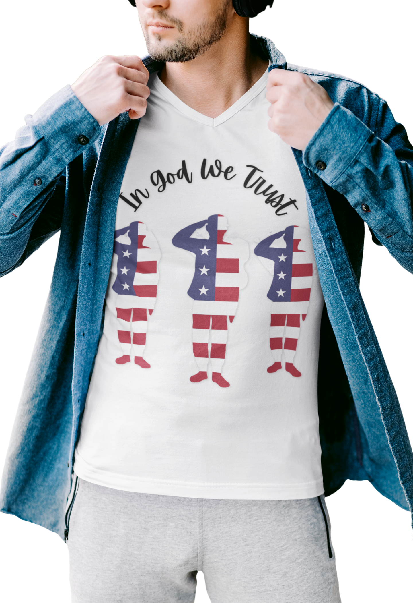 Person wearing a white t-shirt with 'In God We Trust' and a soldier-shaped American flag design, paired with a denim jacket.