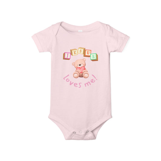 Pink baby onesie with teddy bear and 'Jesus loves me' text on a white background