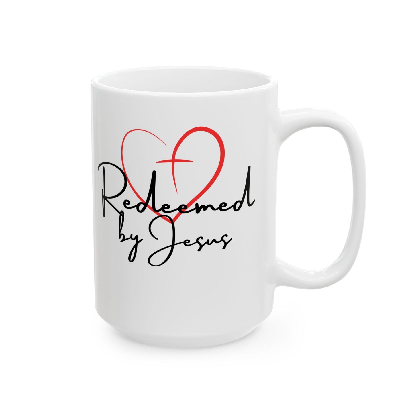 White mug with 'Redeemed by Jesus' text and red heart design on a white background