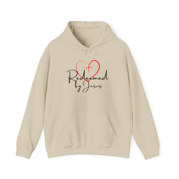 Beige hoodie with 'Redeemed by Jesus' text and heart design on a white background