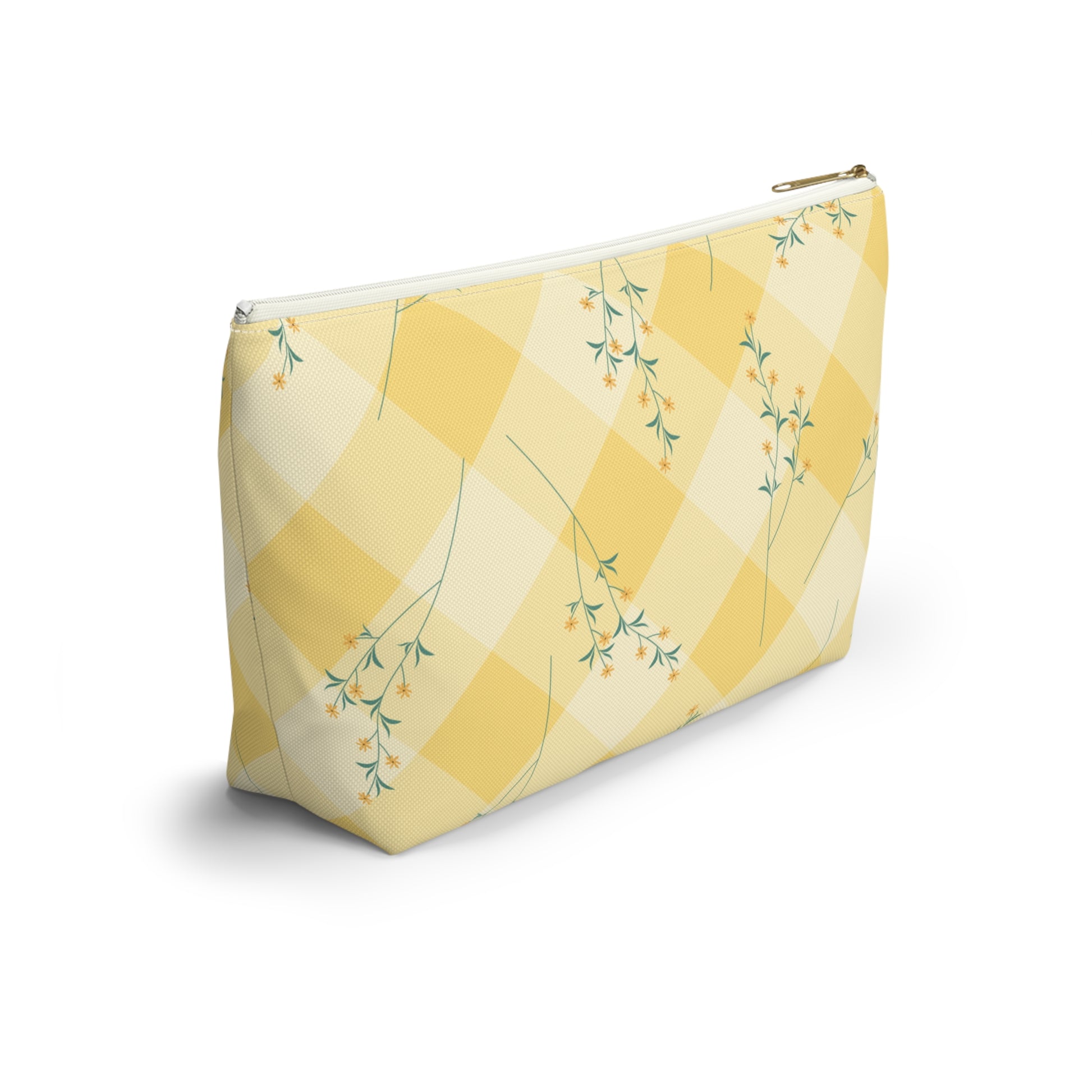 Yellow cosmetic bag with floral pattern on a white background