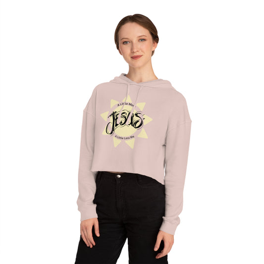 Person wearing a light pink hoodie with a graphic design on a white background