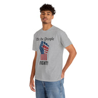 Person wearing a gray t-shirt with 'We the People' and fist graphic on a white background