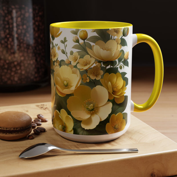 Floral mug with yellow flowers on a wooden surface with coffee beans and a macaron.