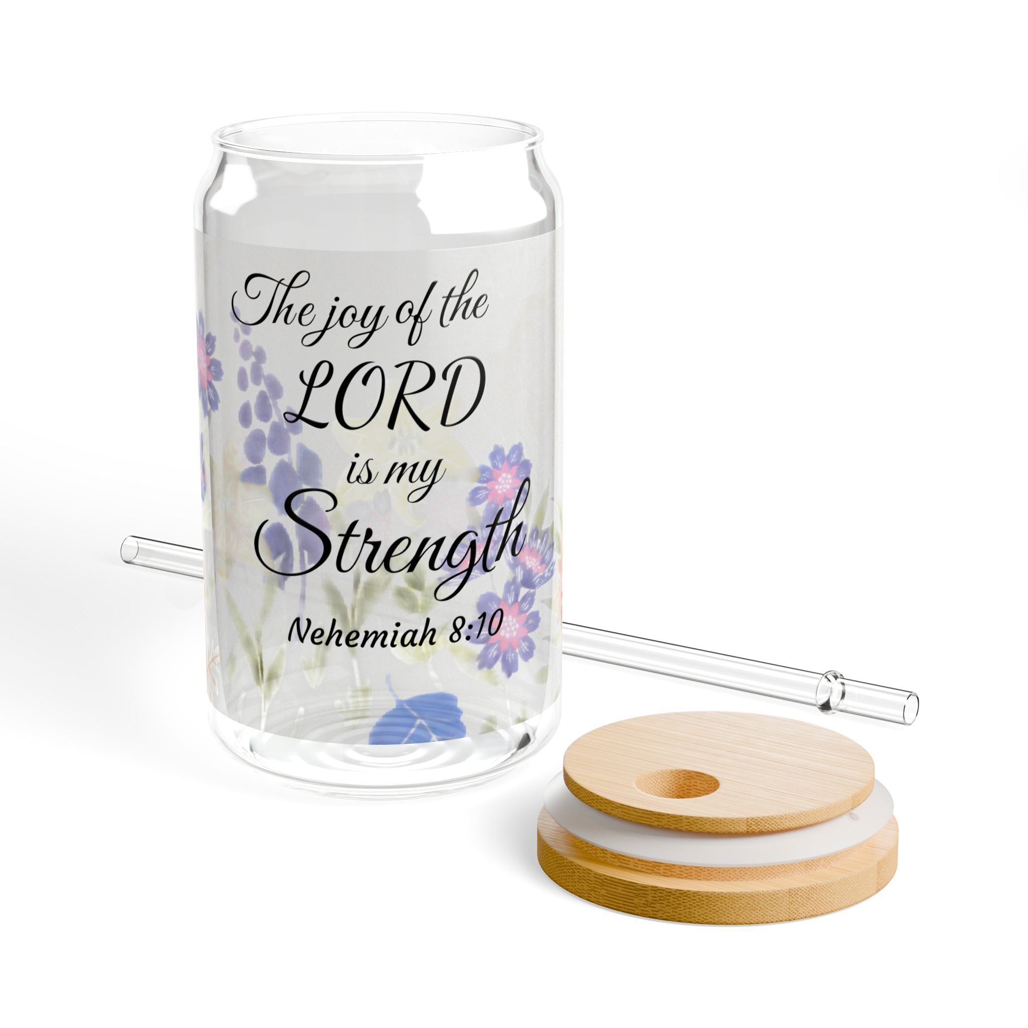 Glass jar with floral design and faith-inspiring quote, accompanied by wooden coasters and straws on a white background.