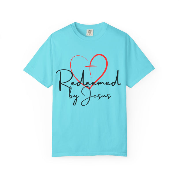 Turquoise t-shirt with a red heart and text 'Redeemed by Jesus' on a white background