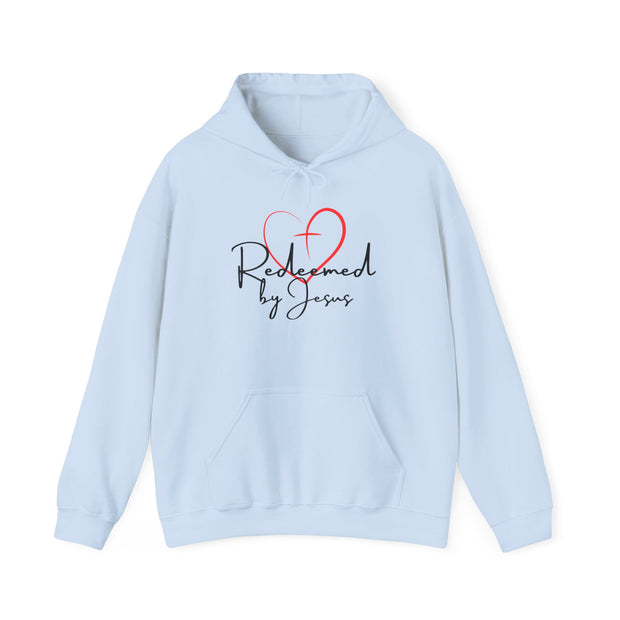 Light blue hoodie with 'Redeemed by Jesus' text and red heart design on a white background