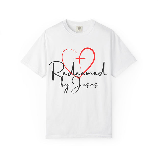 White t-shirt with a red heart and black text 'Redeemed by Jesus' on a white background