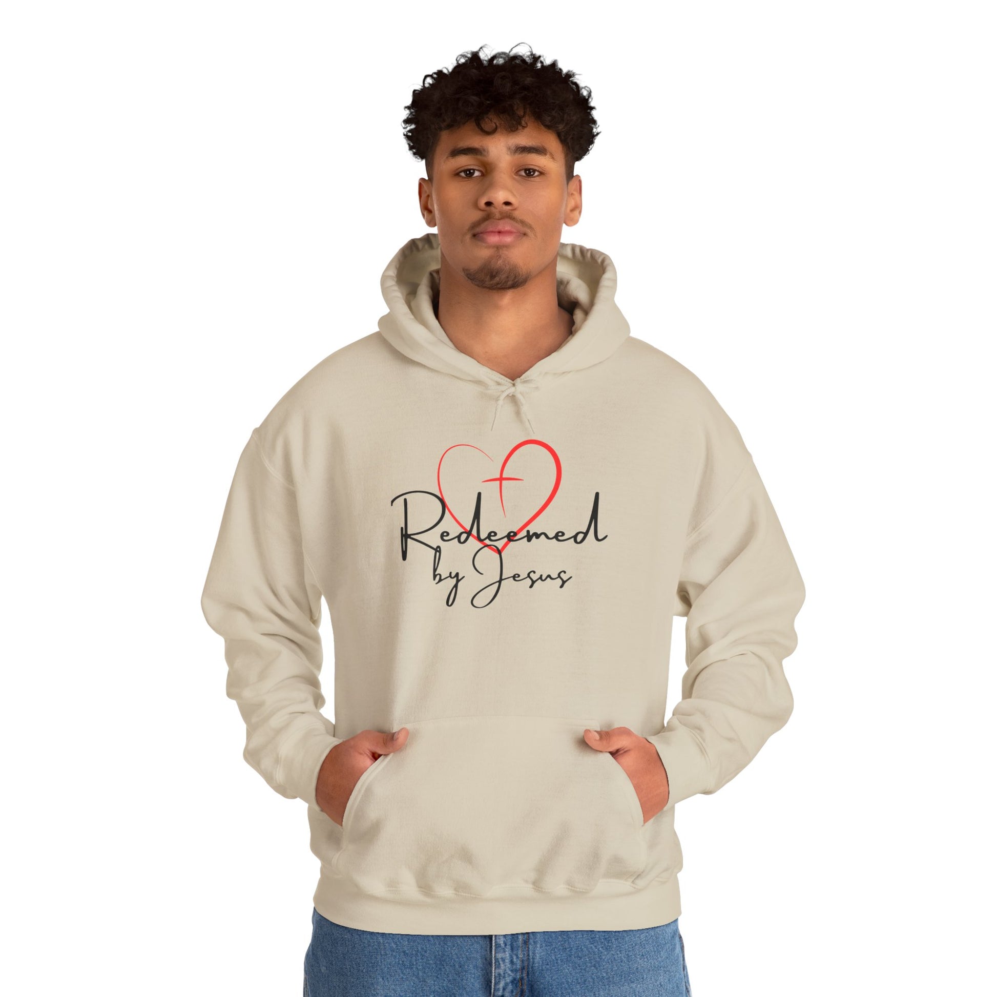 Person wearing a beige hoodie with 'Redeemed by Jesus' design on a white background