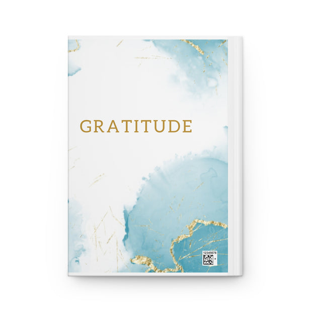 Notebook with 'Gratitude' text on a blue and gold abstract design cover