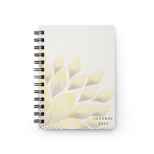 Journal with gold leaf design on a white background