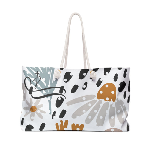 Tote bag with floral and abstract design on a white background