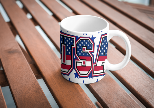 Mug with USA-shaped American flag design on a wooden surface