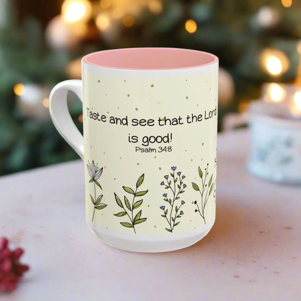 Mug with floral designs and text on a white background