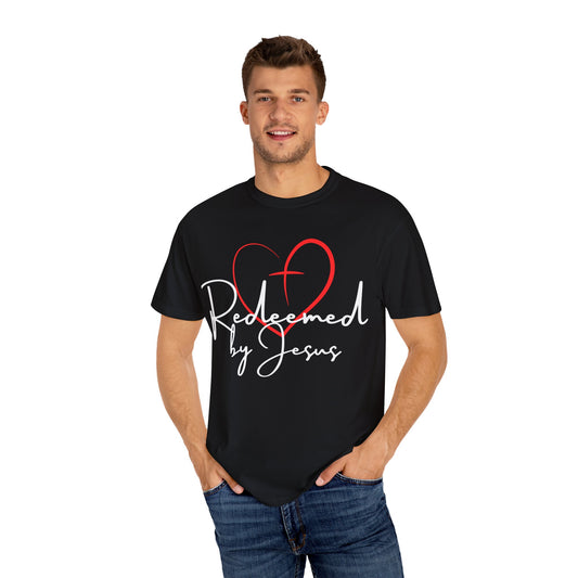 Man wearing a black t-shirt with 'Redeemed by Jesus' design on a white background