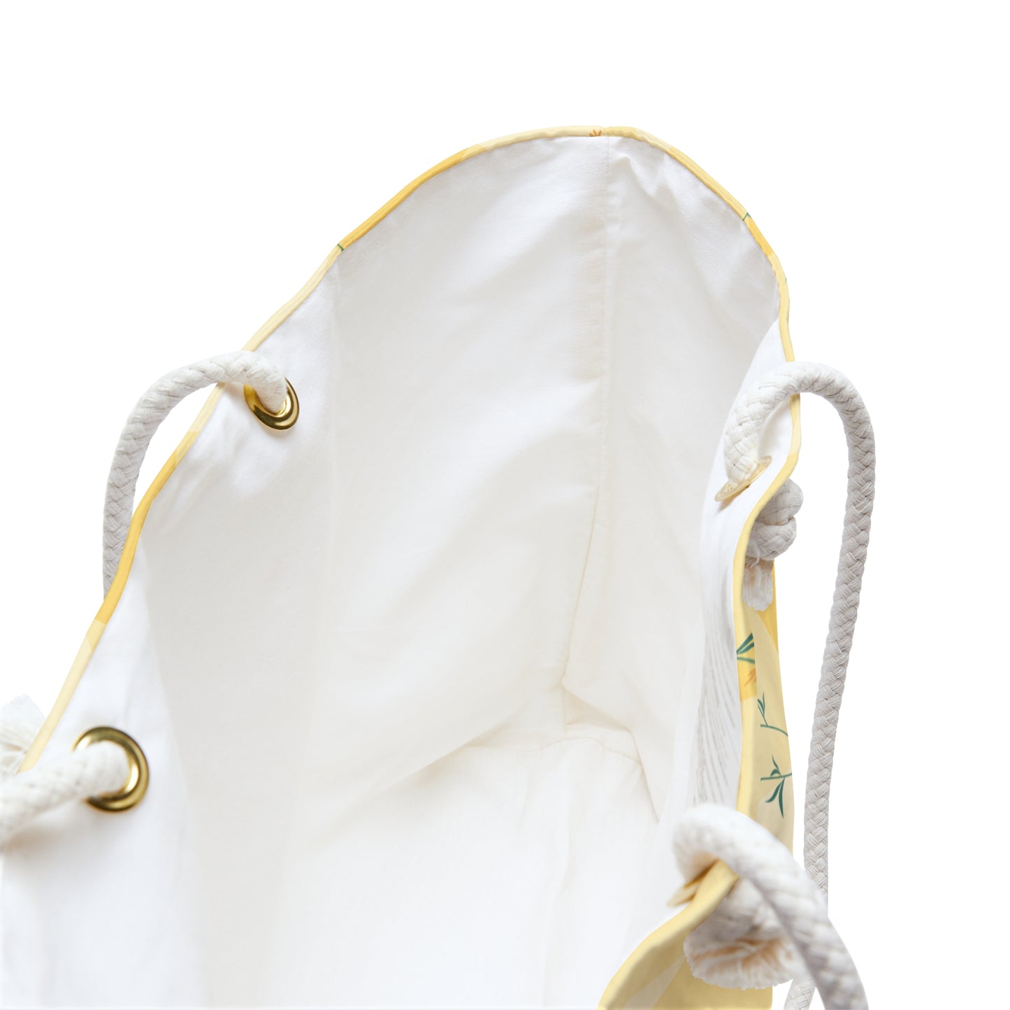 Inside view of white drawstring bag with gold accents on a white background