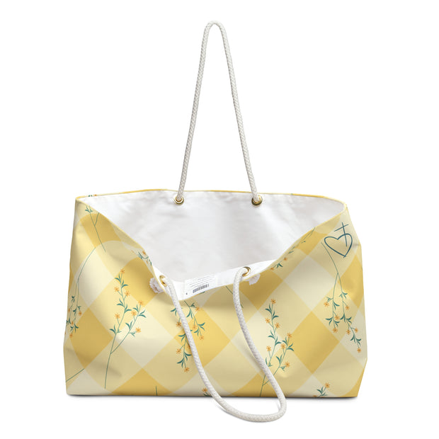 Yellow and white checkered bag with floral patterns on a white background