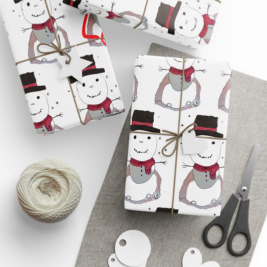 Gift wrap with snowman design, scissors, and string on a white surface