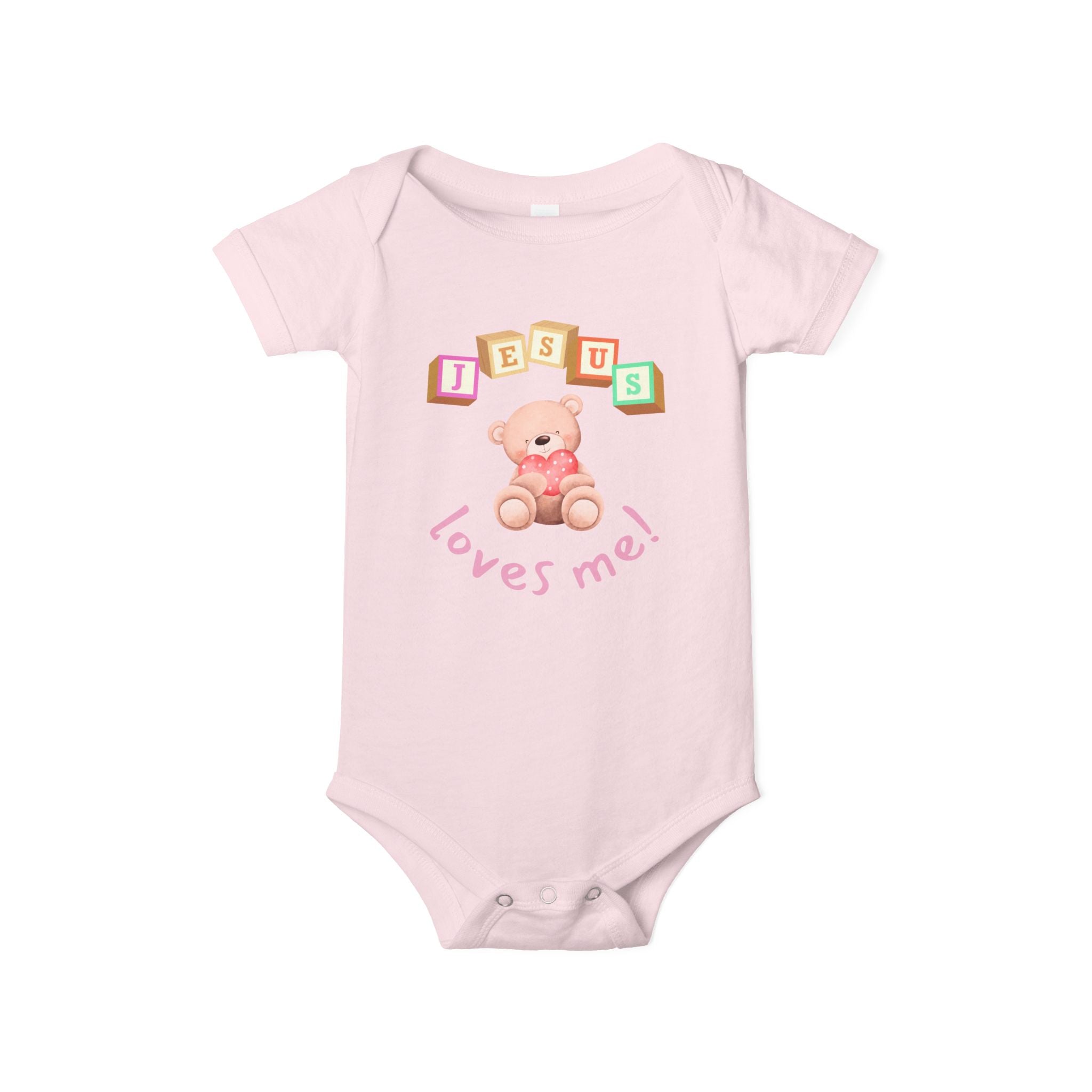 Pink baby onesie with teddy bear and 'Jesus loves me' text on a white background