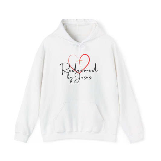 White hoodie with 'Redeemed by Jesus' text and red heart design on a white background
