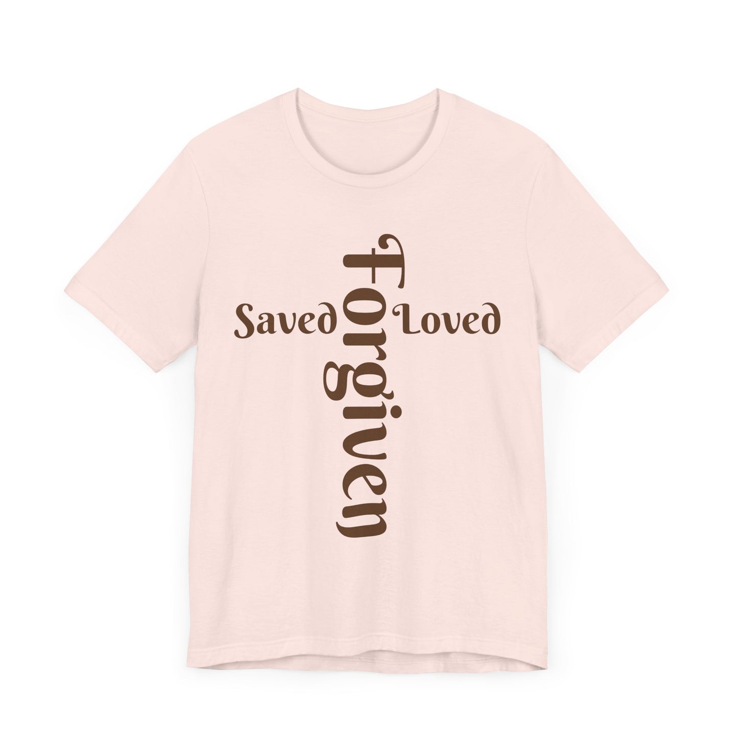 Pink t-shirt with 'Saved, Loved, Forgiven' text on a white background