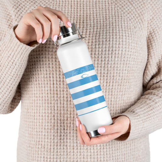 Person holding a white water bottle with blue stripes and a silver cap.