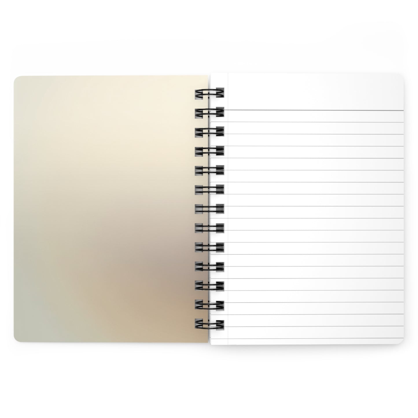 Open view of notebook with beige cover and lined pages on a white background