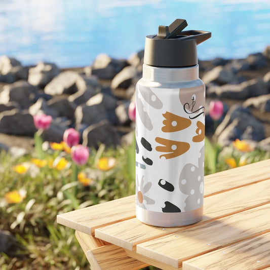 Water bottle with animal pattern on a wooden surface with a scenic background