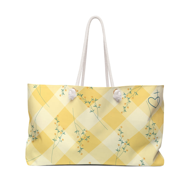 Yellow checkered bag with floral patterns on a white background