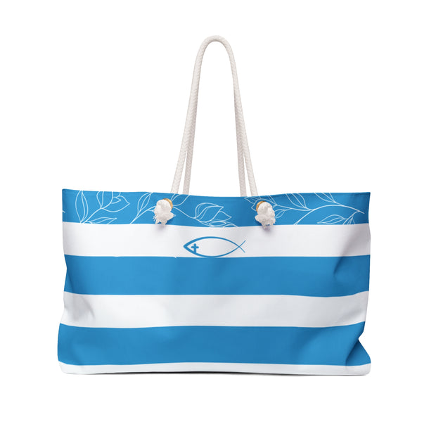 Tote bag with blue and white stripes and a fish symbol on a white background