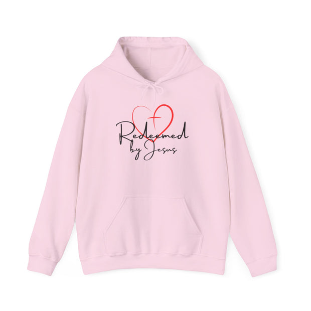 Pink hoodie with 'Redeemed by Jesus' text and heart design on a white background
